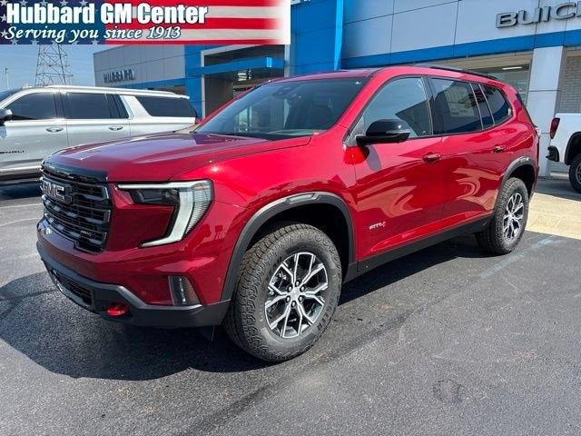2026 GMC Acadia AT4 in Volcanic Red Tintcoat — front three-quarter view