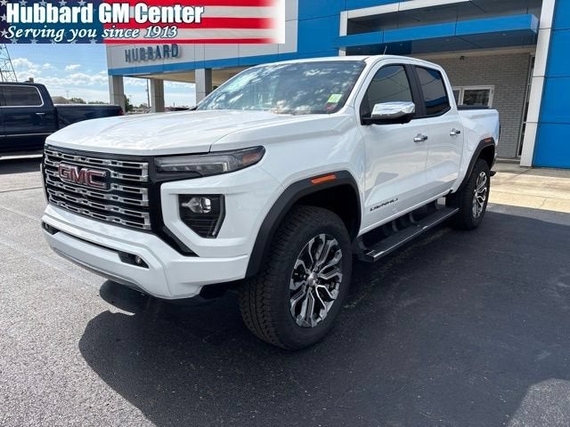2024 GMC Canyon Denali in Summit White — front three-quarter view